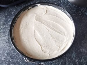 Lemon curd cheesecake filling before it has set instruction image